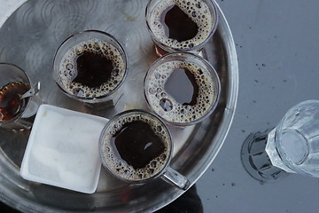 Image showing Foam and bubbles form on the surface after pouring a cup of tea 90