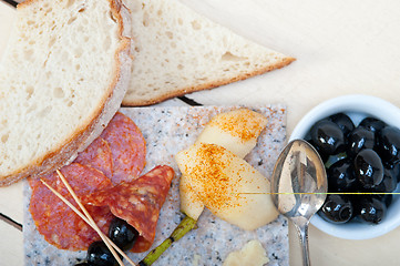 Image showing mix cold cut on a stone with fresh pears