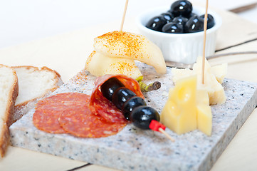 Image showing mix cold cut on a stone with fresh pears