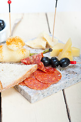 Image showing mix cold cut on a stone with fresh pears