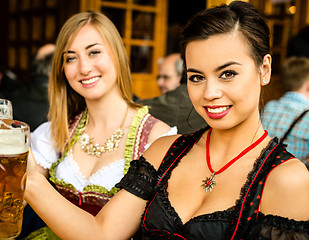 Image showing Girls drinking beer at Oktoberfest