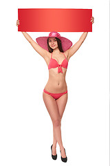 Image showing Woman in swimsuit holding red blank cardboard