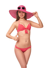 Image showing Woman in pink swimsuit and hat