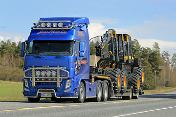 Image showing Volvo FH Truck Hauls Ponsse Forest Harvester