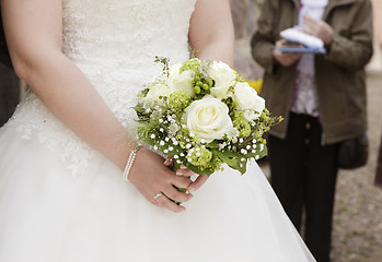 Image showing Bride with bridal bouquet in her hand