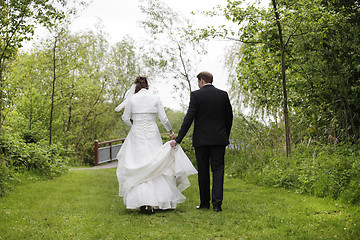 Image showing Bridal couple from behind