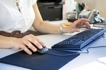 Image showing Business woman typing