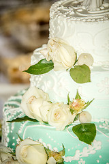 Image showing white wedding cake with roses