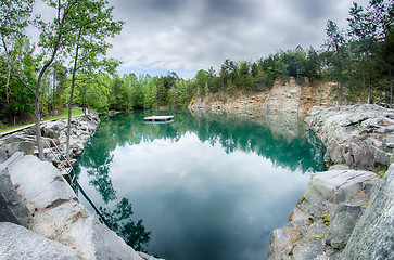 Image showing cloudy skies and reflections at a quarry