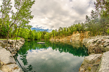 Image showing cloudy skies and reflections at a quarry