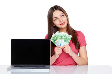 Image showing Woman with euro cash showing blank laptop screen