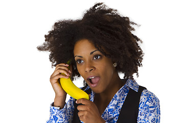 Image showing Female afro american with banana