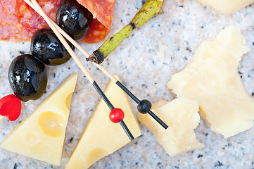 Image showing mix cold cut on a stone with fresh pears