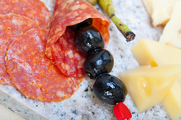 Image showing mix cold cut on a stone with fresh pears