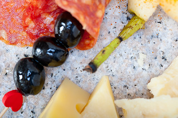 Image showing mix cold cut on a stone with fresh pears