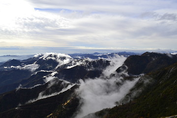 Image showing Clouds on top of the mountains