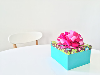 Image showing Bright gift box on white table
