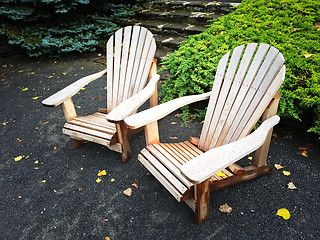 Image showing Wooden chairs in autumn garden