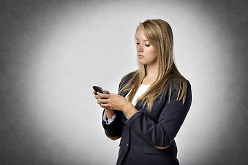 Image showing Businesswoman writes text messages