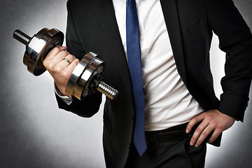 Image showing businessman with dumbbell