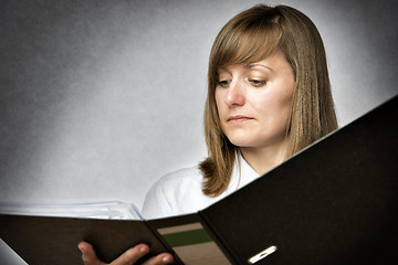 Image showing Female office worker with folder