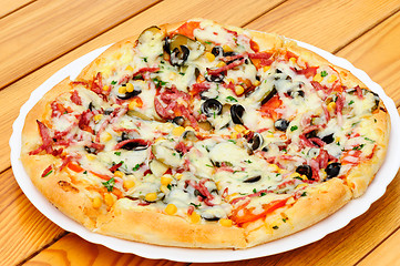 Image showing Pizza with pepperoni, black olives and corn