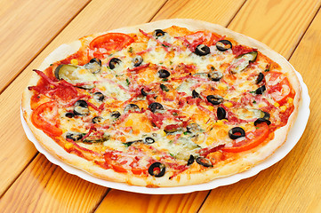 Image showing Pizza with pepperoni, black olives and corn