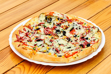 Image showing Pizza with pepperoni, black olives and corn