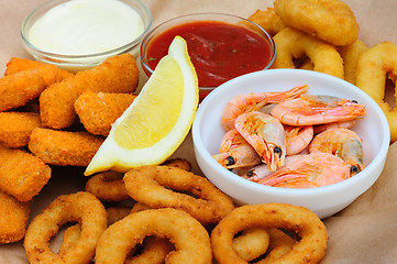Image showing beer snack, shrimps, calmar rings and fish sticks