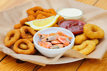 Image showing beer snack, shrimps, calmar rings and fish sticks