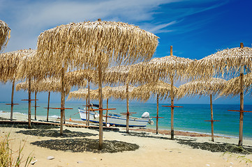 Image showing Reed umbrellas on the beach