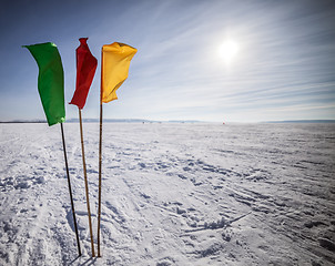 Image showing Flags on the background of winter sky