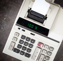 Image showing Old calculator showing a percentage - 100 percent