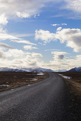 Image showing Snowy volcano landscape with dramatic clouds in Iceland