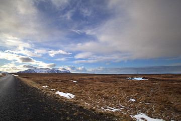 Image showing Snowy volcano landscape with dramatic clouds in Iceland