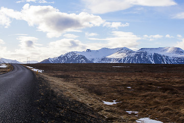 Image showing Snowy volcano landscape with dramatic clouds in Iceland