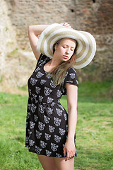 Image showing Cheerful fashionable woman in stylish hat and frock posing