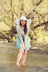 Image showing Cheerful fashionable woman in stylish hat and frock posing