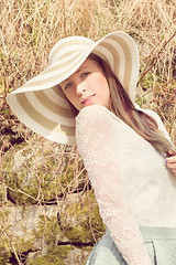 Image showing Cheerful fashionable woman in stylish hat and frock posing