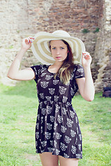 Image showing Cheerful fashionable woman in stylish hat and frock posing