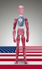 Image showing Wood figure mannequin with US state flag bodypaint - Wyoming