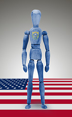 Image showing Wood figure mannequin with US state flag bodypaint - Nevada