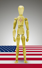 Image showing Wood figure mannequin with US state flag bodypaint - New Mexico