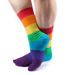 Image showing Men\'s hairy legs in colored striped socks fun