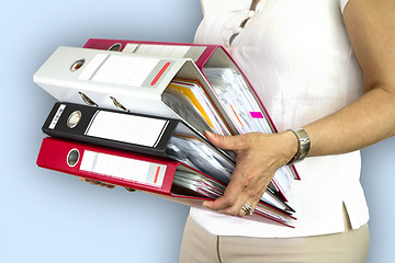 Image showing Secretary holding binders