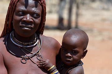 Image showing Himba woman with child in the village