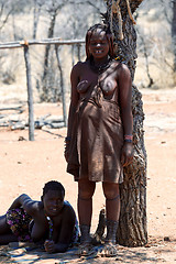 Image showing Himba woman with ornaments on the neck in the village