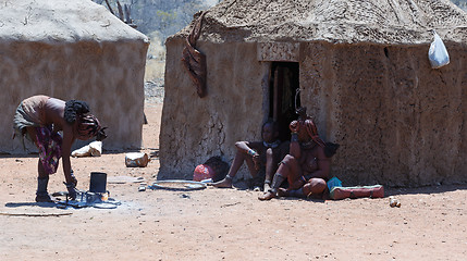 Image showing Himba woman with child in the village