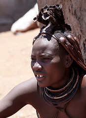 Image showing Himba woman with ornaments on the neck in the village