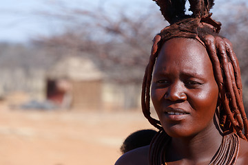 Image showing Himba woman with ornaments on the neck in the village